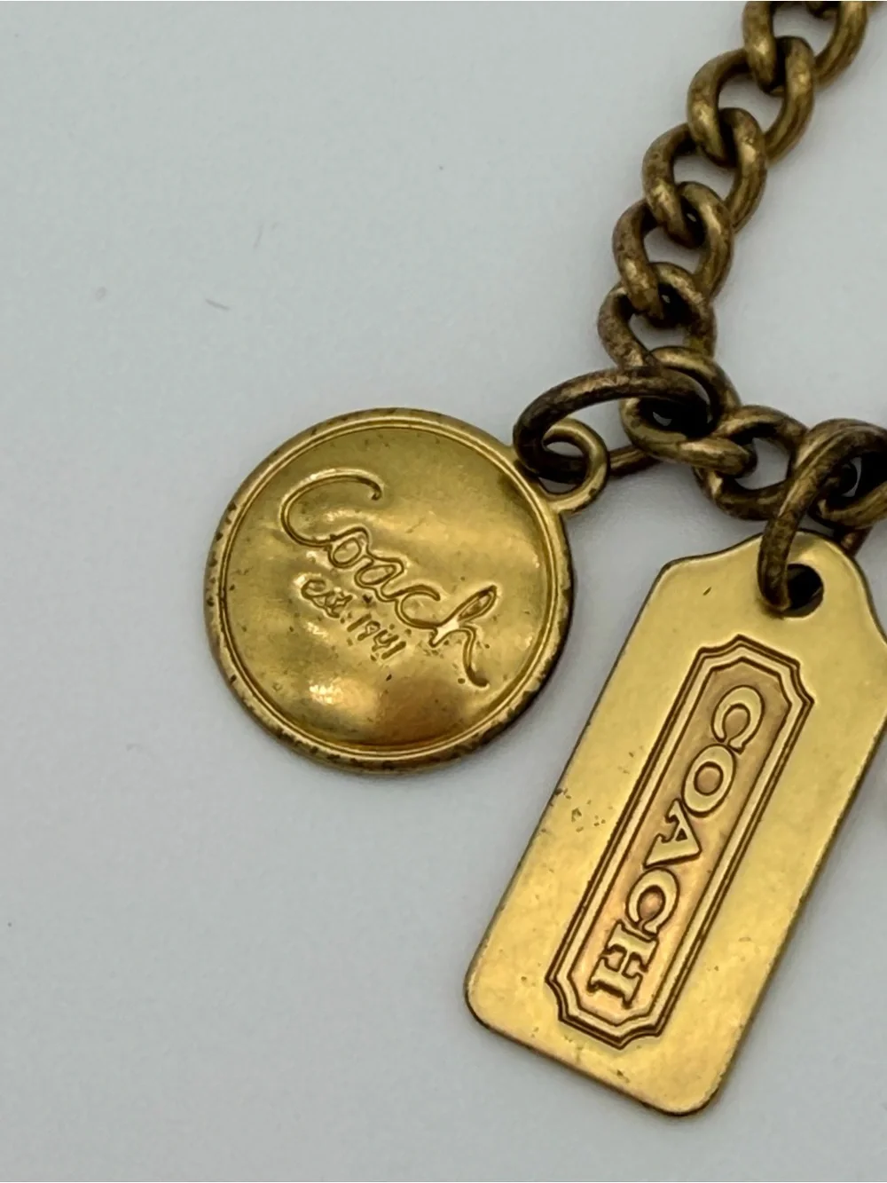 COACH Brass Charm Bracelet with Coach Tags & Horse Carriage Charm